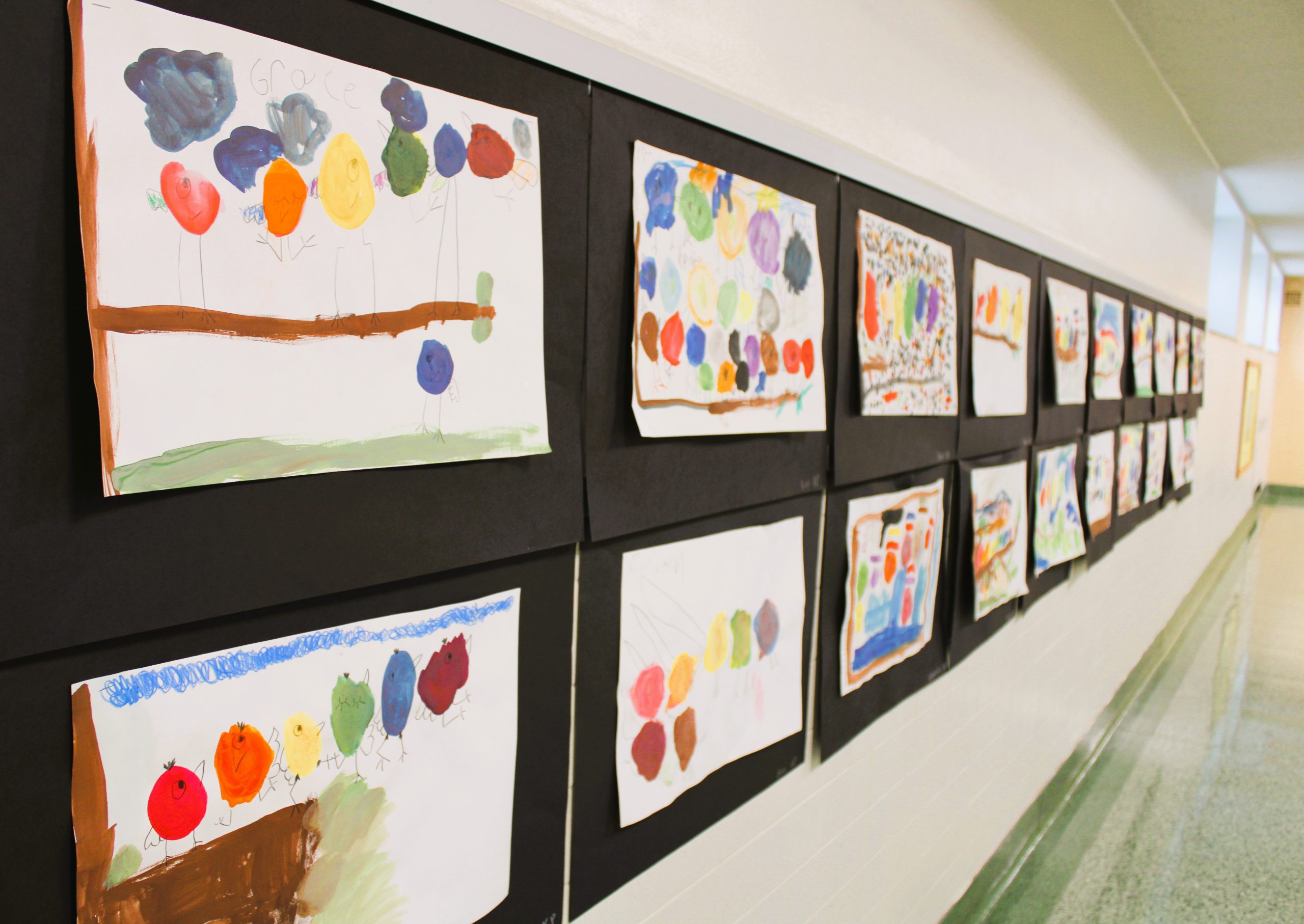 Image of student art hanging in hallway.