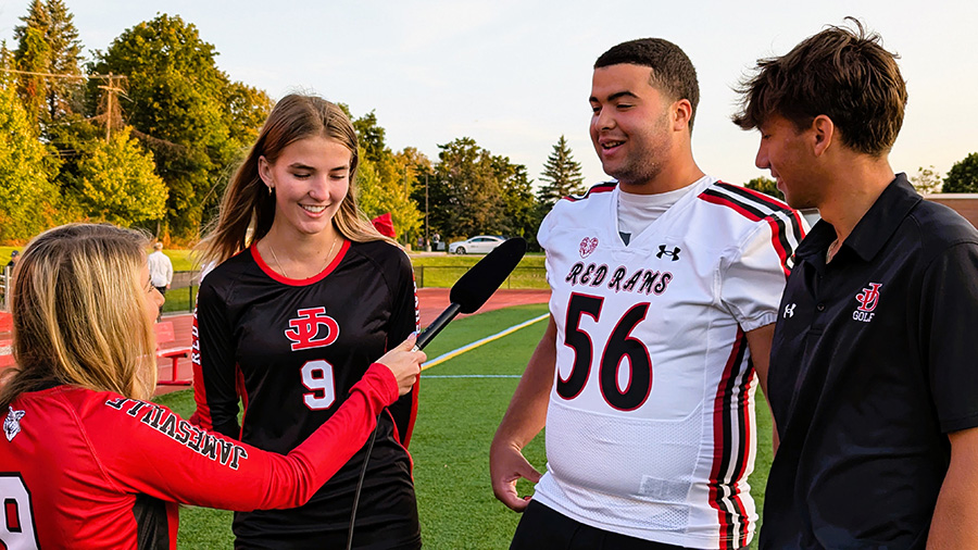 J-DHS student-athletes being interviewed by NewsChannel 9 anchor during Friday Morning Lights.