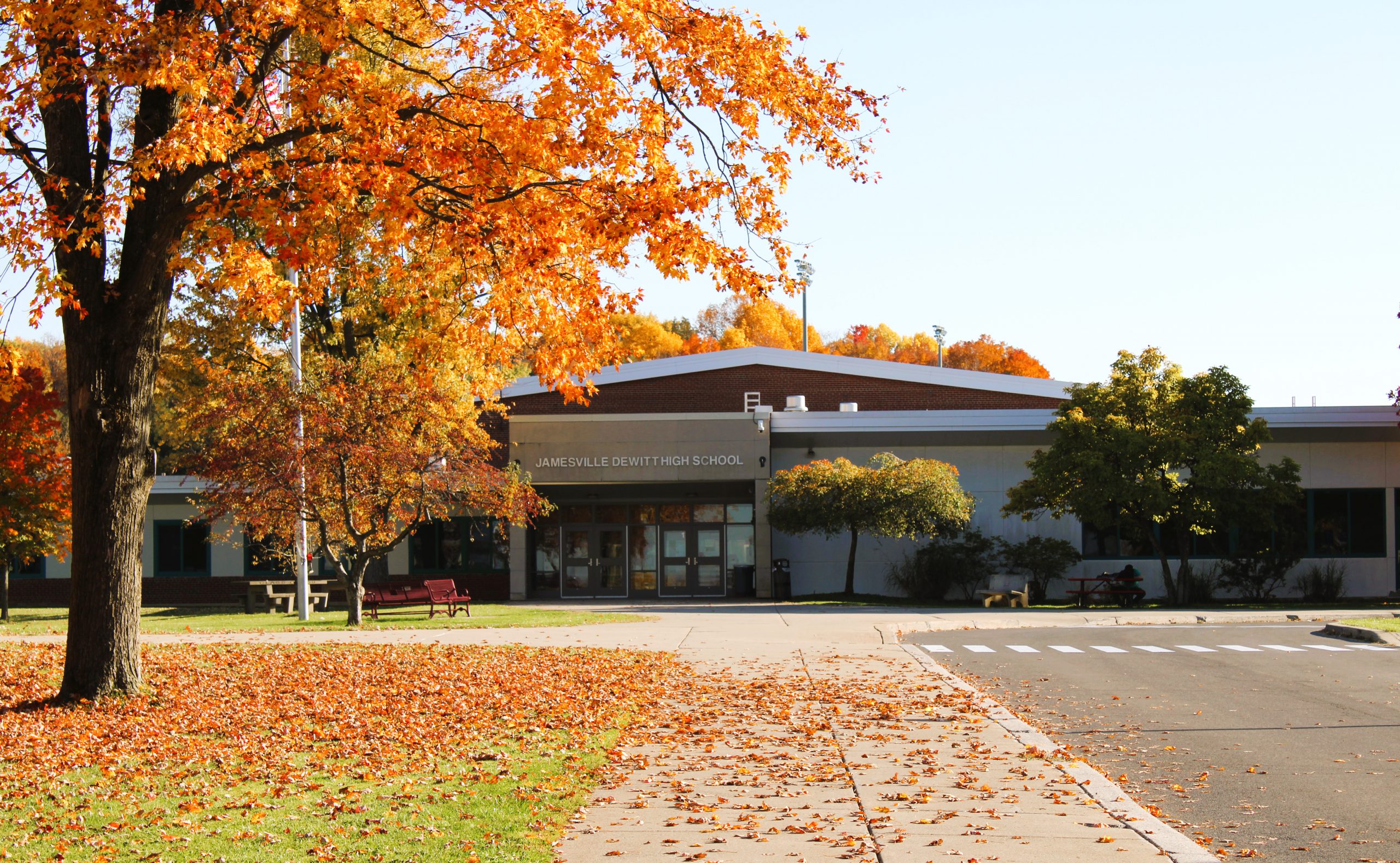 exterior view of J-DHS during the fall with orange leaves. 