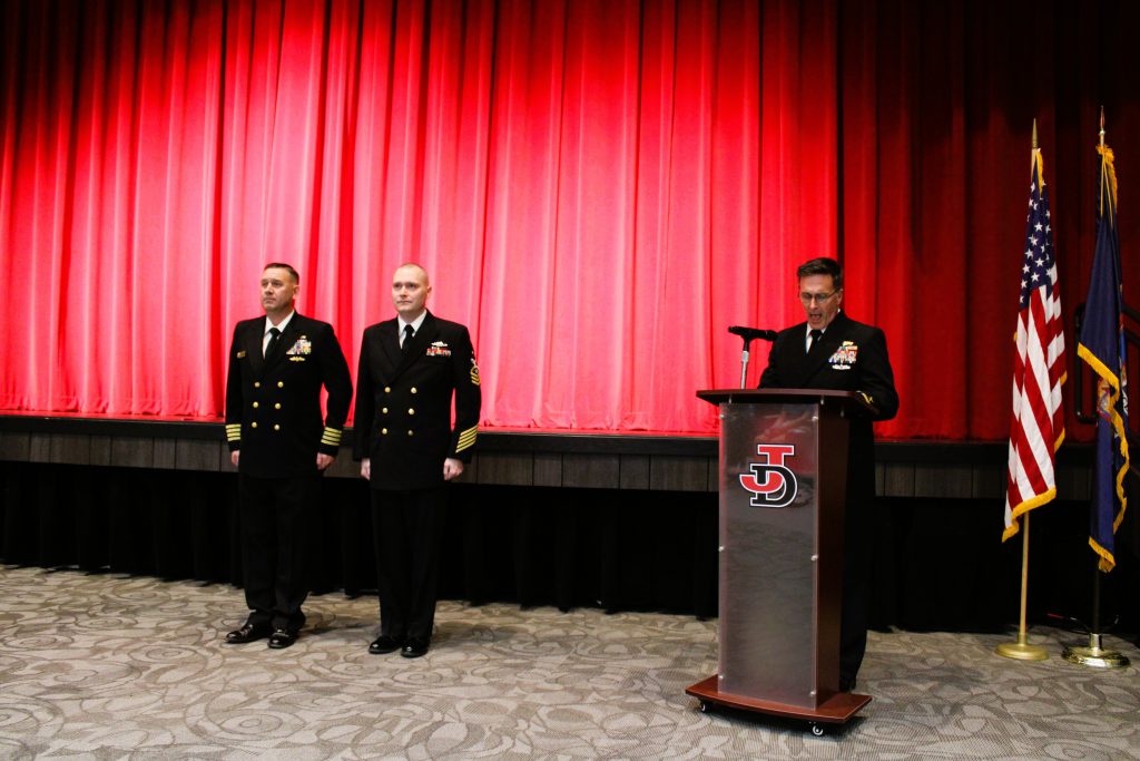 Principal Gregory Lawson reenlists in U.S. Navy.