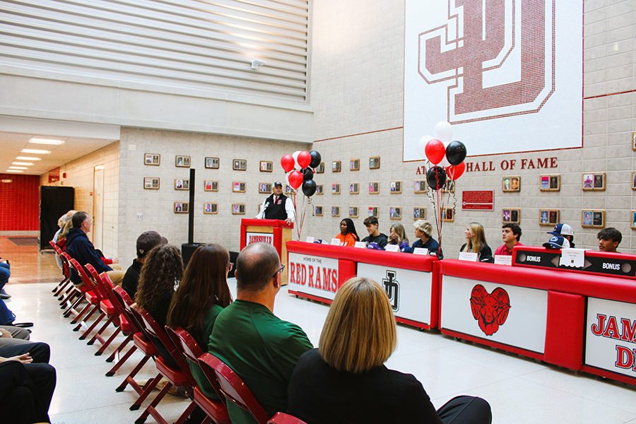 J-DHS student-athletes sit at table during 2024 National Letter of Intent Signing event.