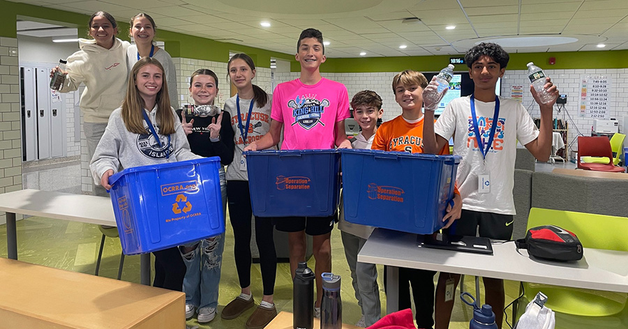 Sustainability Club members pose with bins.