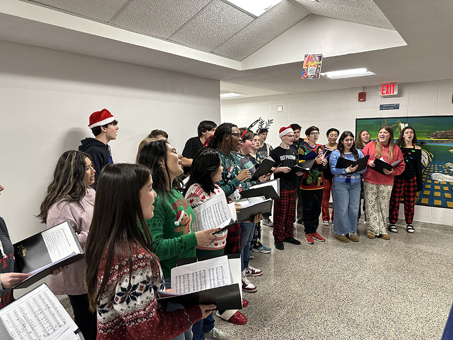 In Achord carols outside the District Office.