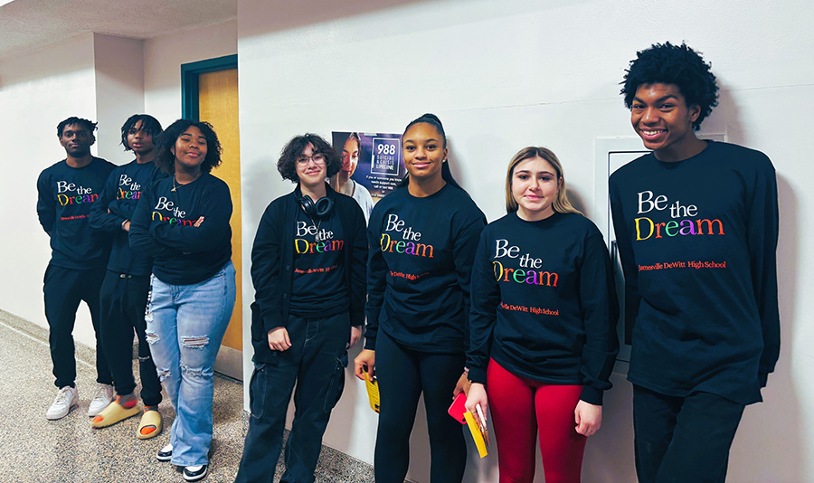 J-DHS students pose for photo before Black History Month assembly wearing "Be the Dream" shirts.