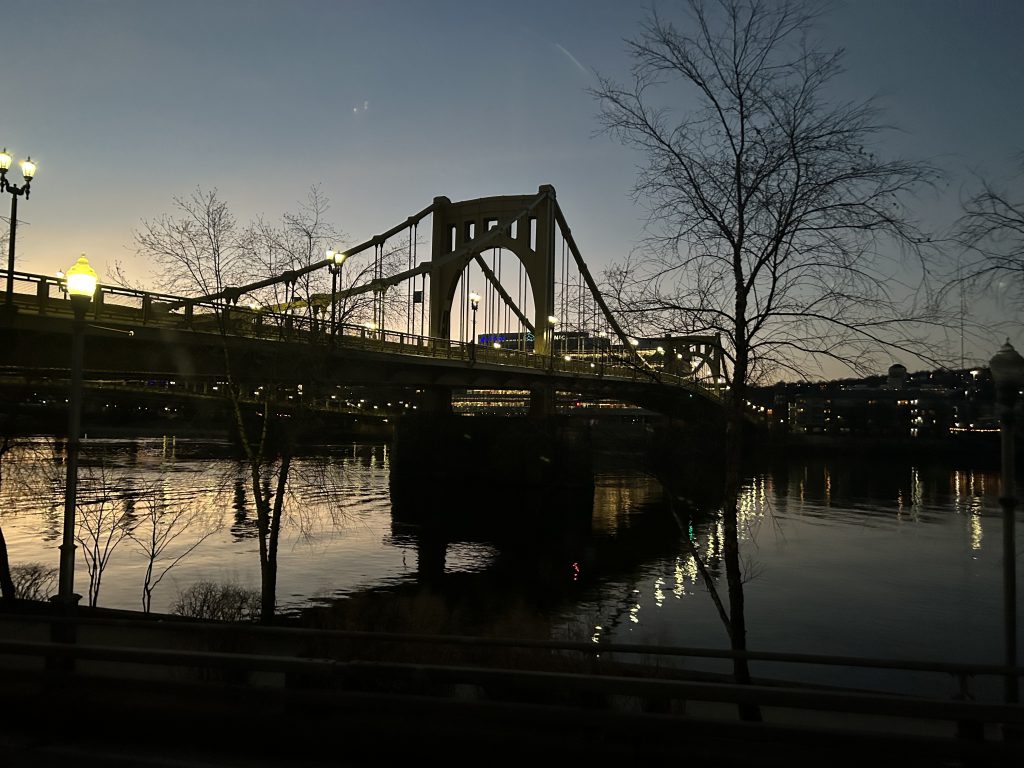 Silhouette of bridge at dusk. 