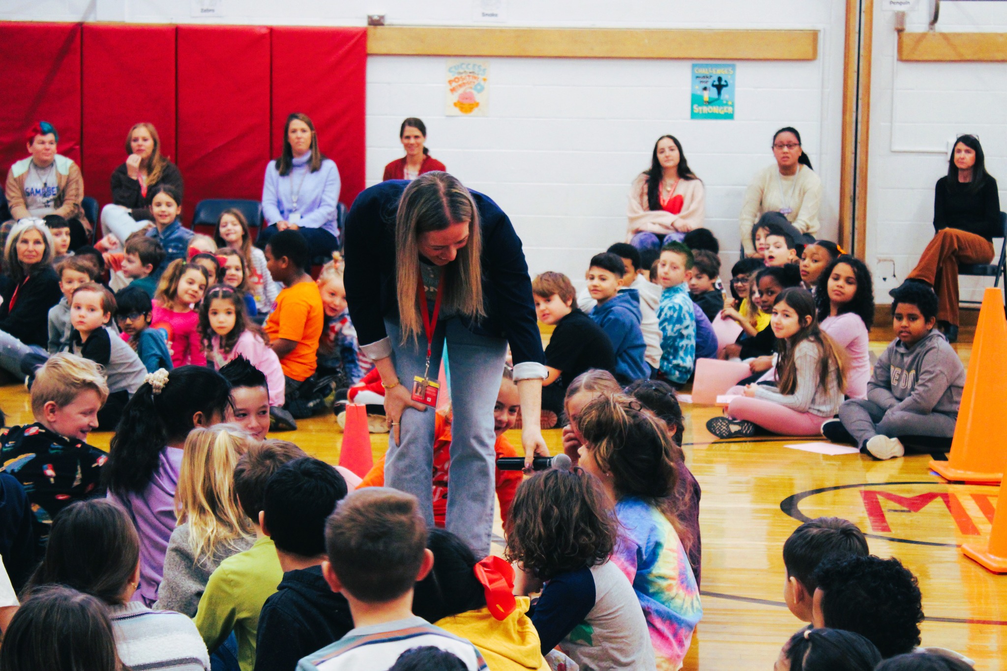 Sarah Hayes asked students questions during kindness assembly.